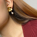 Gold plated flower earrings with violet stone pearl