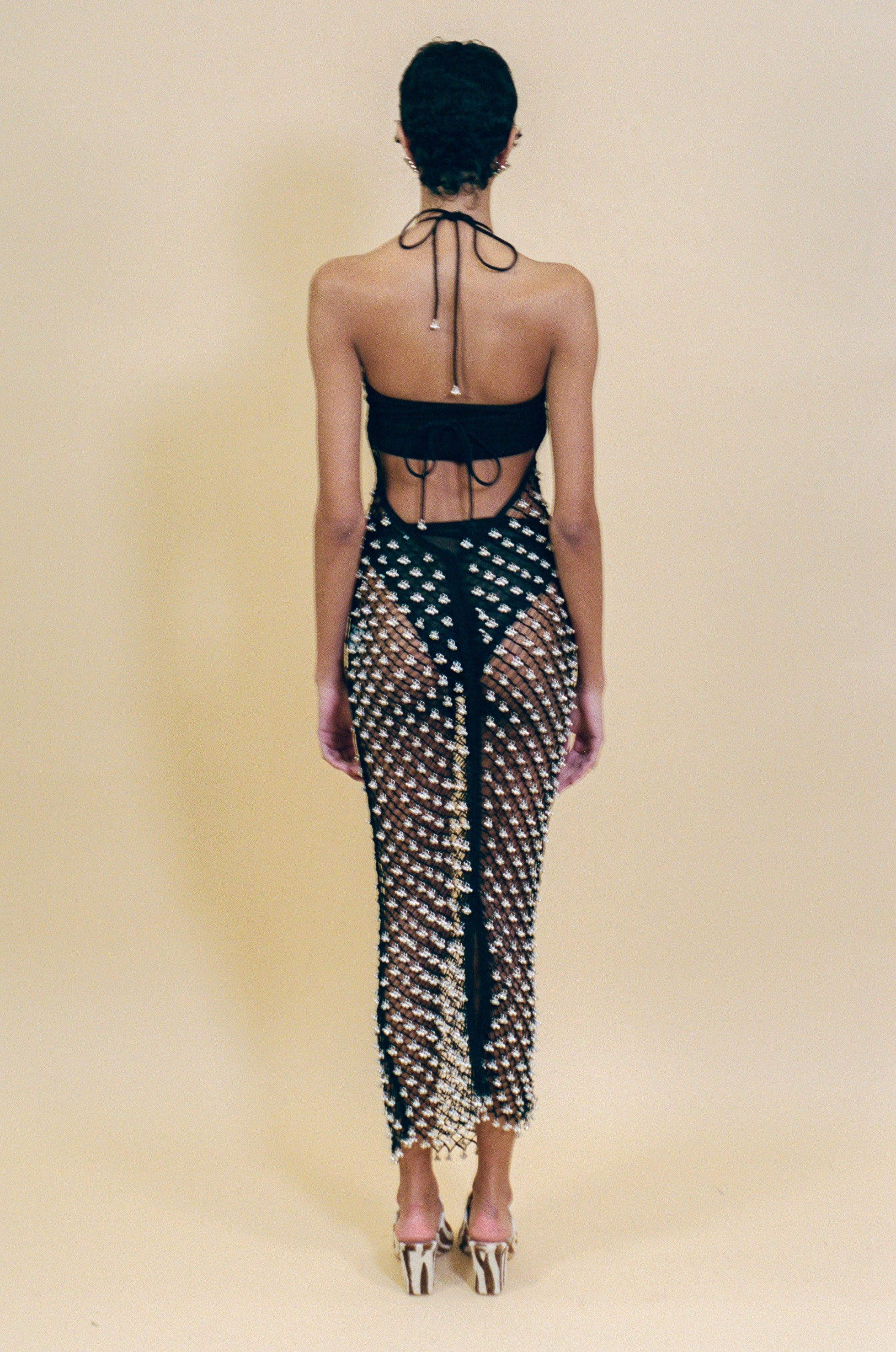 black cotton crochet halter dress with beaded bells