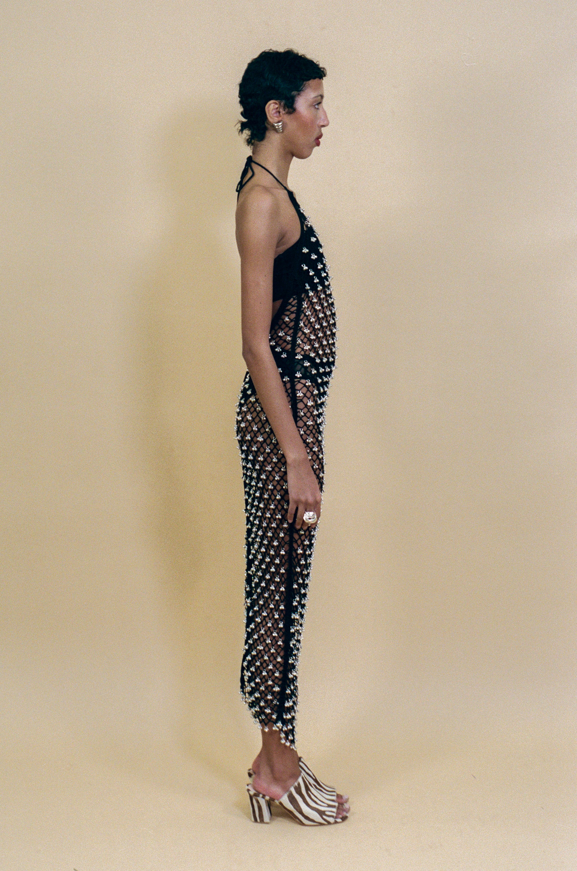 black cotton crochet halter dress with beaded bells