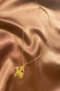 gold dainty horserider pendant on a thin chain