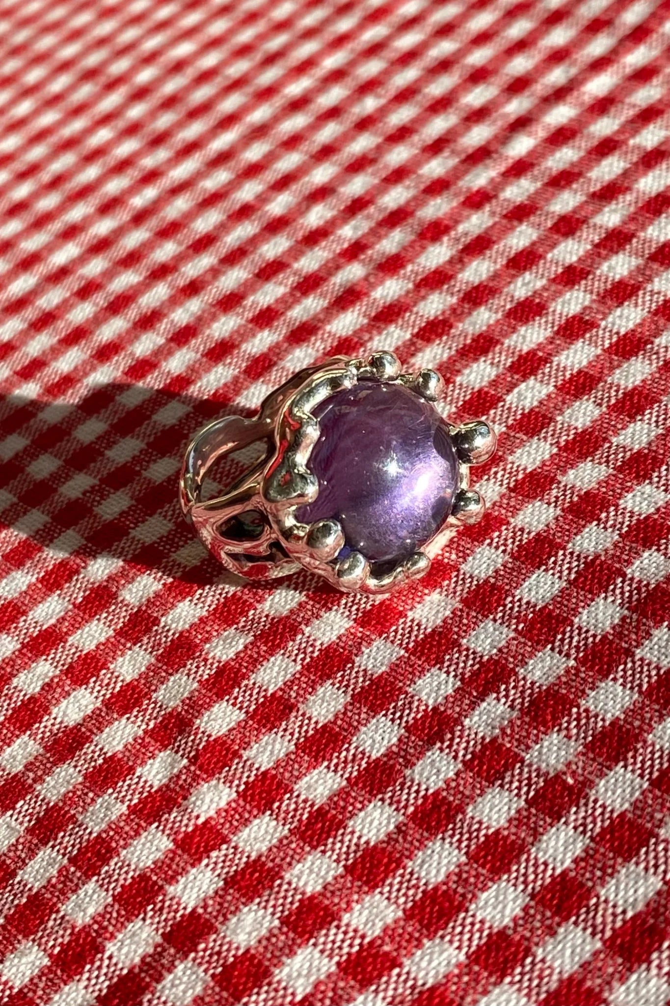 sterling silver textured ring with large purple stone