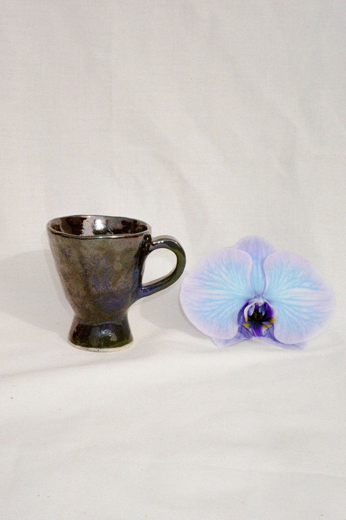 handmade ceramic mug in blue and black glaze