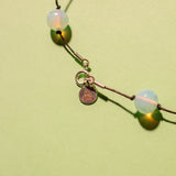 NOUÉ NECKLACE IN OPALINE BLUE MARBLED/BLACK