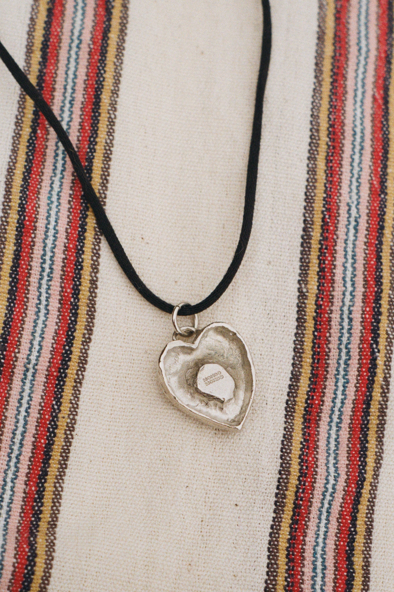 white bronze blue heart charm black cord necklace