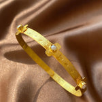 gold dainty bracelet with pearl crosses