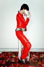 Load image into Gallery viewer, red psychedelic waxy smooth trouser with zebra cuff