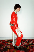 Load image into Gallery viewer, red psychedelic waxy smooth trouser with zebra cuff