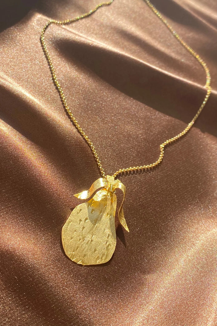 gold etched pear necklace on a dainty chain