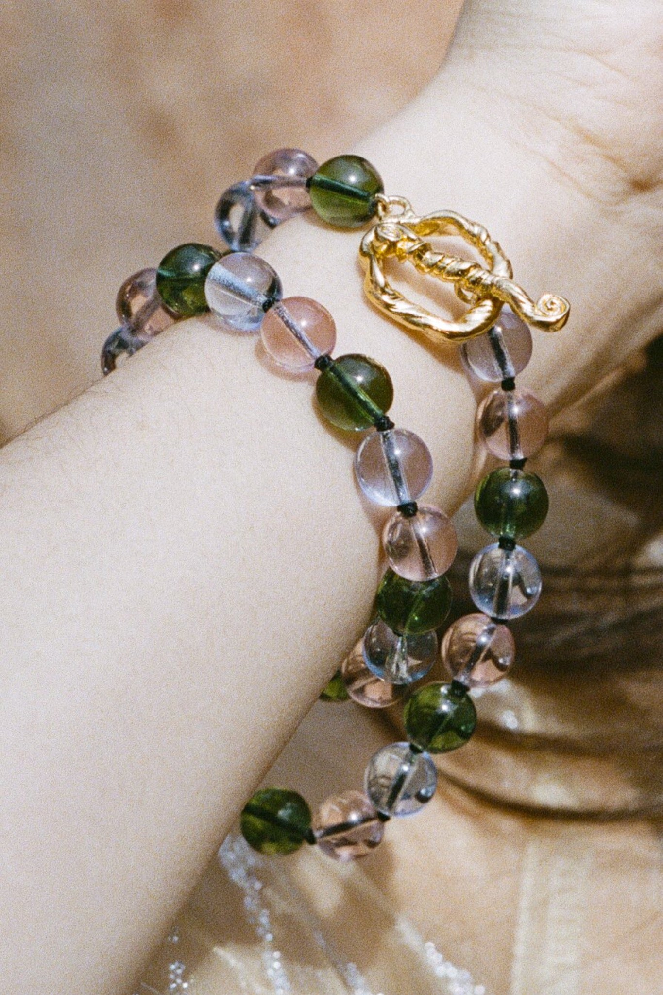 multi coloured glass beaded necklace on silk thread