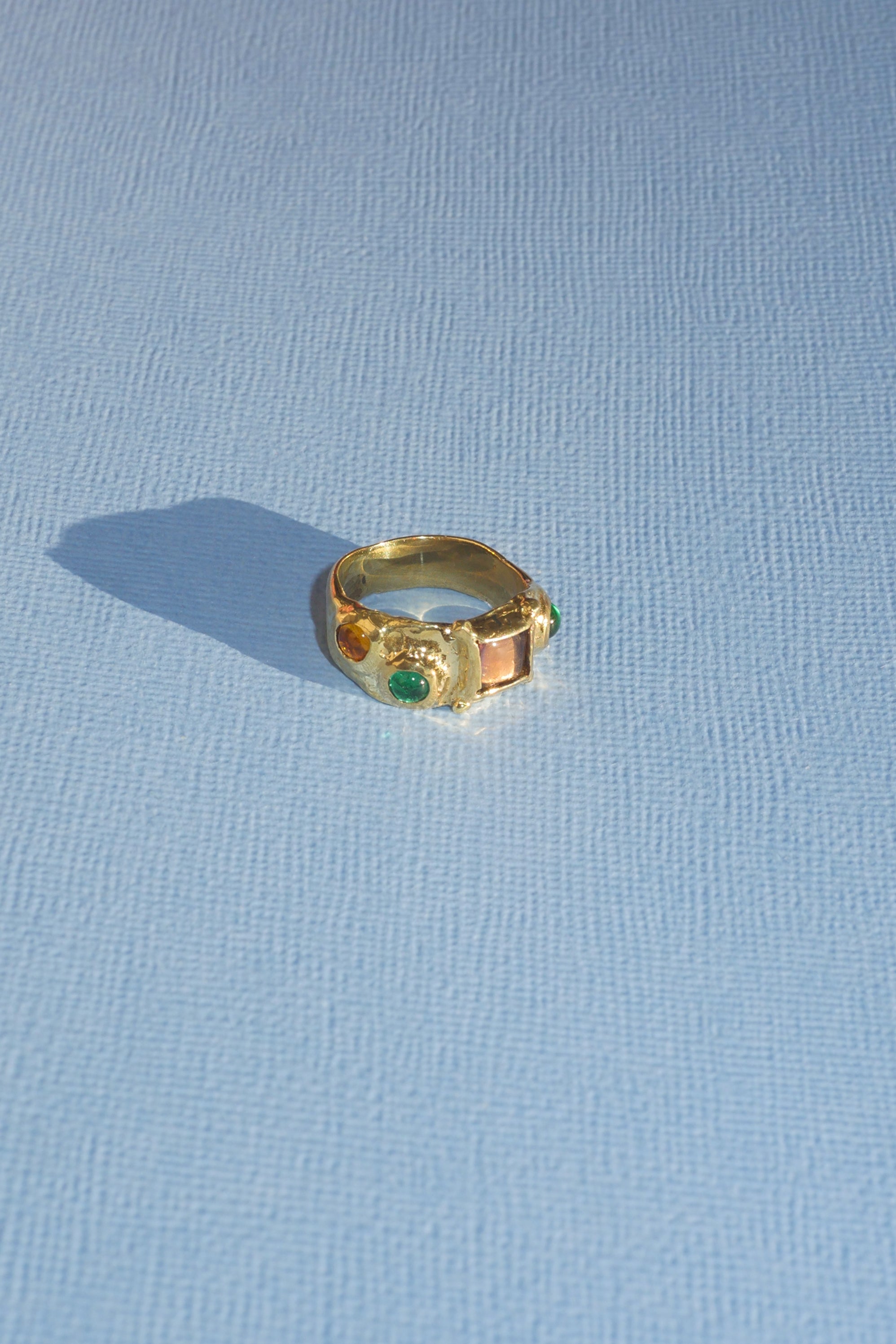 textured brass band ring with coloured glass stones
