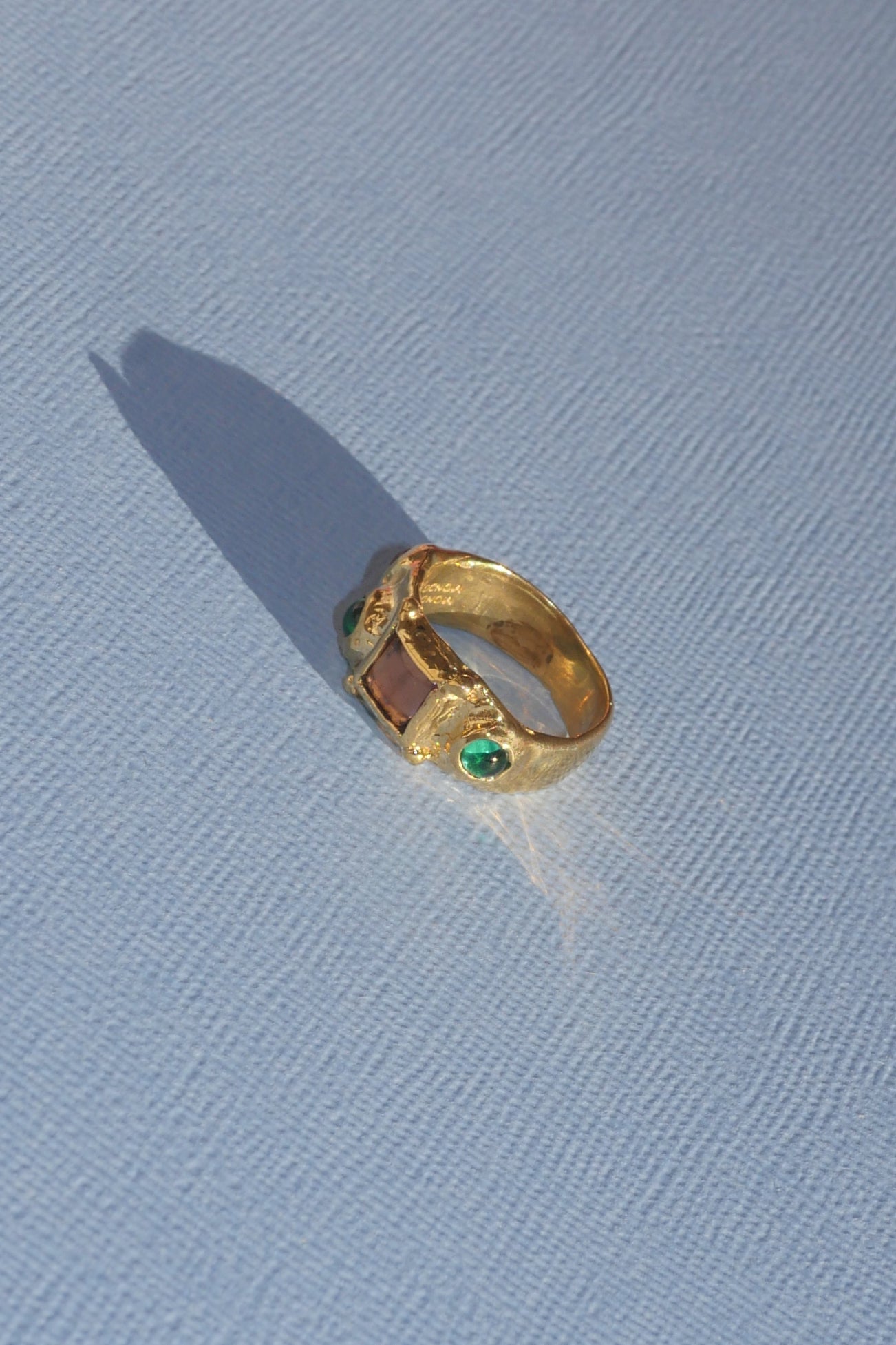 textured brass band ring with coloured glass stones