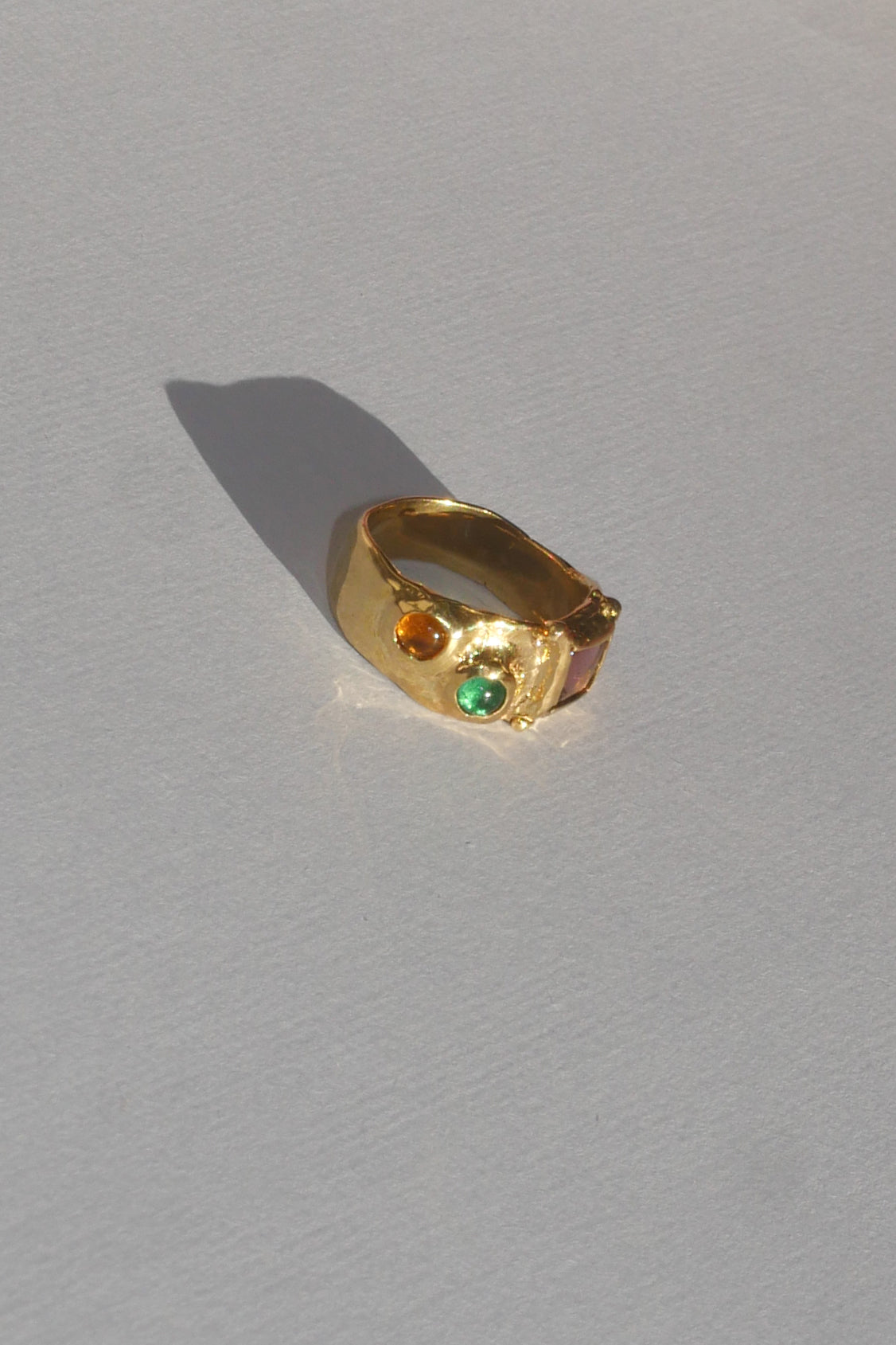 textured brass band ring with coloured glass stones