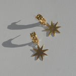 brass demi hoop earrings with dangling star
