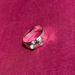 silver textured band ring with clear glass stones