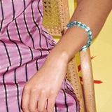 teal glass bead bracelet strung on silk thread