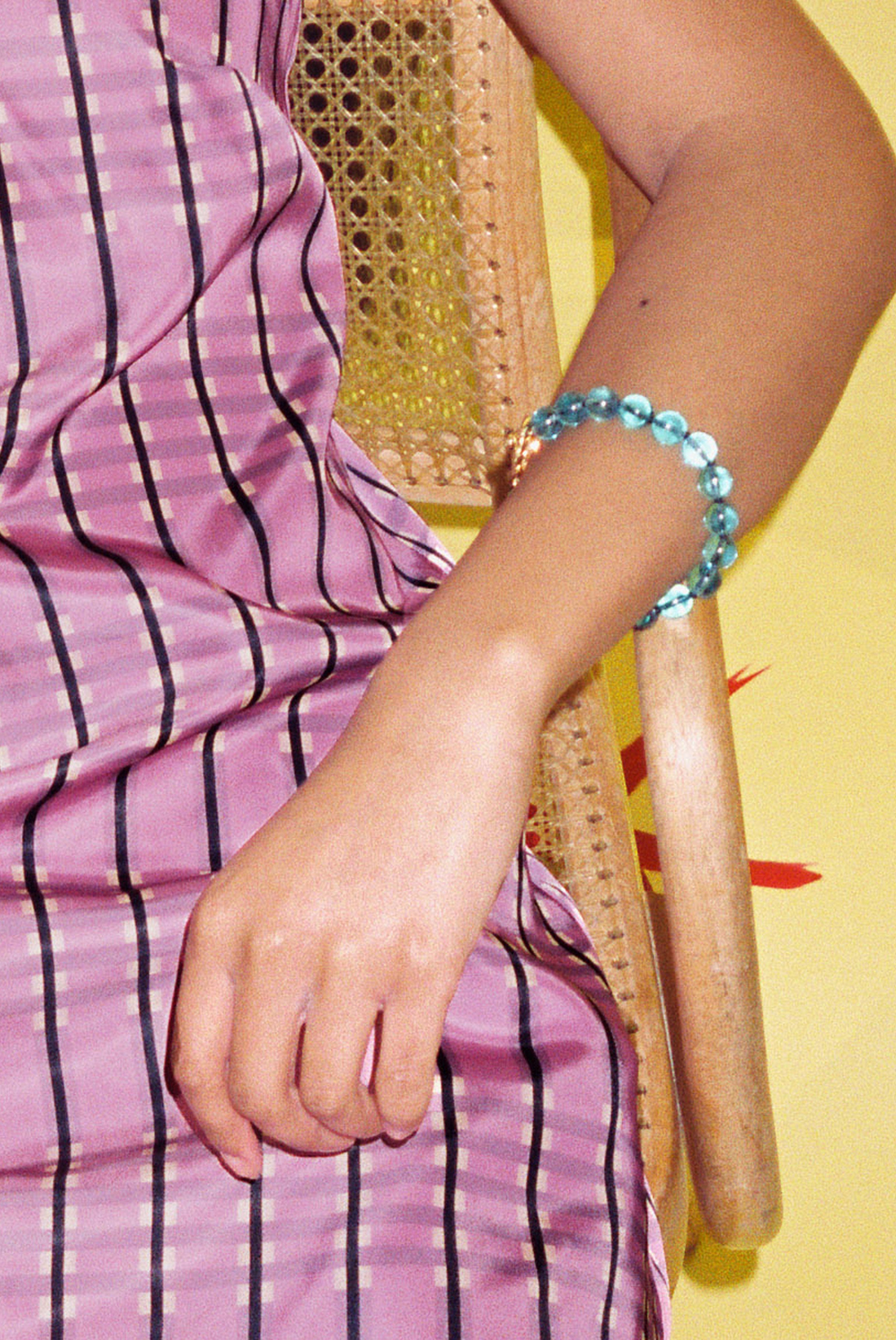 teal glass bead bracelet strung on silk thread
