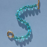 teal glass bead bracelet strung on silk thread