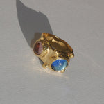 brass textured ring with blue and lavender cabochons