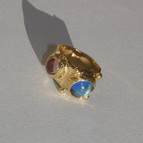 brass textured ring with blue and lavender cabochons