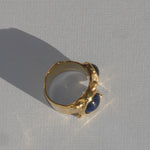 brass textured ring with blue and lavender cabochons