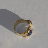 brass textured ring with blue and lavender cabochons