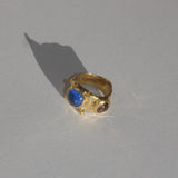 brass textured ring with blue and lavender cabochons