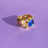 brass textured ring with blue and lavender cabochons