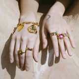 textured brass band ring with glass cabochons